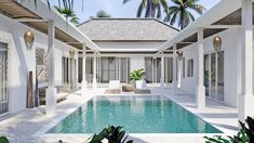 an outdoor swimming pool surrounded by palm trees and white walls with doors leading to it