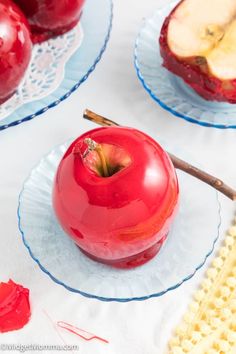 there are two plates with apples on them