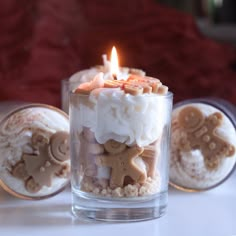 a candle that is sitting in some kind of cupcake with frosting on it