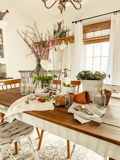 a wooden table topped with lots of dishes