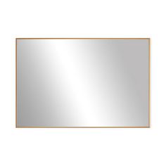 an empty mirror on a white wall with a gold border around the edges and bottom edge