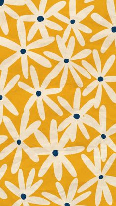 an orange and white flower pattern with blue dots