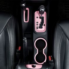 the interior of a car with black leather seats and pink trims is seen from above