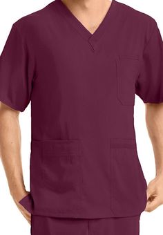 Experience the fashion, comfort, and sustainability of the KD110 by Barco collection!  This durable top is loaded with pockets-- seven in all, including two front pockets, two hidden side pockets, a cell phone pocket, and a double chest pocket with pen slot.  A high low hem gives you added coverage in the back.  These scrubs are made to make a difference: each scrub set is made from 5 recycled plastic bottles.   Barco KD110 Men's Justin 7-pocket Scrub Tops  V-neck  Seven pockets  High low... Greys Anatomy Men, Stylish Scrubs, Staff Uniforms, Hospitality Uniform, Mens Scrubs, Lab Coats, Tops For Men