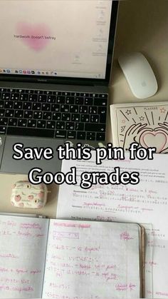 a laptop computer sitting on top of a desk next to an open book and mouse