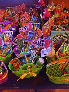 a table topped with lots of candy and candies on top of each other in baskets