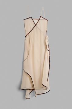 Semi-sheer silk laced-up long dress with straps. 100% Silk. V-NECK TIE SILK DRESS BEIRA SIZE 1 2 3 CHEST 86 cm 33,8 in 88 cm 34,6 in 90 cm 35,4 in HIP 99 cm 38,9 in 101 cm 39,7 in 103 cm 40,5 in LENGTH 139 cm 54,7 in 139 cm 54,7 in 139 cm 54,7 in STRAP 38 cm 14,9 in 38 cm 14,9 in 38 cm 14,9 in MINIMUM OVERLAP OF THE TIE 94 cm 37 in 94 cm 37 in 94 cm 37 in Spring Wrap Dress With Wrap-around Straps, Spring Wrap Dresses With Wrap-around Straps, Sheer Sleeveless Silk Maxi Dress, Sleeveless Sheer Silk Maxi Dress, Summer Silk Wrap Dress With Tie Waist, Silk Wrap Dress With Tie Waist For Summer, Summer Silk Wrap Dress, Sheer V-neck Maxi Dress For Daywear, Spring Silk Wrap Maxi Dress