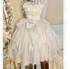 43099509588015|43099509620783|43099509653551 White Balletcore Party Dress, White Fitted Skirt For Garden Party, Fitted White Skirt For Garden Party, Beige Wedding Skirt With Ruffles, Vintage Ruffled Skirt For Wedding, Vintage White Dress With Ruffled Skirt, White Balletcore Skirt With Ruffles, Vintage Wedding Dress With Ruffled Skirt, Vintage Beige Party Skirt