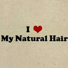 the words i love my natural hair are written in black ink on a beige background