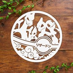 an image of a sticker on a wooden surface with leaves and plants around it