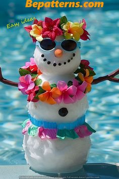 a snowman made out of fake flowers in the pool