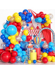 a circus themed birthday party with balloons and cake