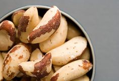 some kind of food that is in a metal bowl on a table or counter top