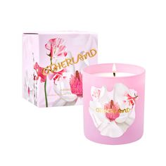 a pink candle in front of a box with flowers on it and the words, motherland