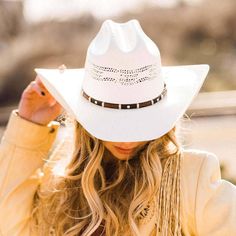 Montana | Womens Straw Cowgirl Hat brings western style and durability together. Made from firm Bangora straw, this roper-style hat features a faux leather band with silver studs, perfect for women seeking a stylish and sun-shielding cowgirl look. Material: Midweight Firm Bangora Straw Shape: Cowboy Trim: Faux Leather Band with Silver Studs Brim Size: 4" Crown Height: 4 1/2" Sweatband: Elastic Sweatband Imported Cowboy Hat Photography, Straw Cowgirl Hat, American Hat Makers, American Hat, Country Cowgirl, Straw Cowboy Hat, Western Hat, Cowgirl Hat, Western Hats