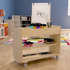 a child's playroom with toys and art supplies