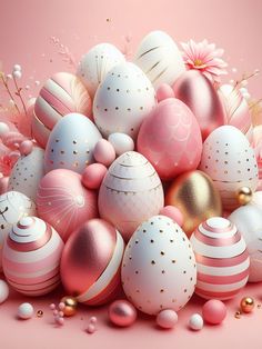 a pile of pink and white easter eggs on a pink surface with gold dots around them