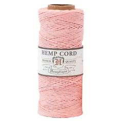 pink hemp cord spooled on a white background