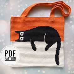 an orange and white bag with a black cat on the front is featured in this image