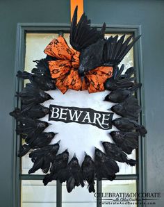 there is a sign that says beware with black birds and orange butterflies on it