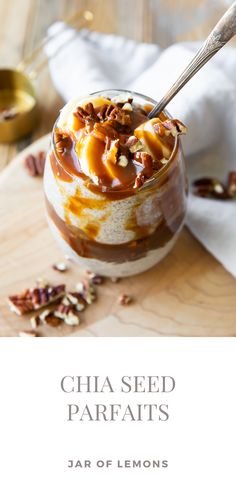 a dessert in a glass with nuts and caramel on top