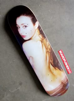 a skateboard with an image of a naked woman on it's bottom half