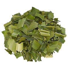 a pile of green leaves on a white background