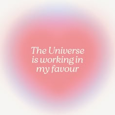 the universe is working in my favour quote on pink and blue blurry background