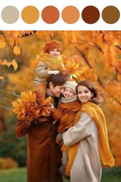 a family is posing for a photo in the fall