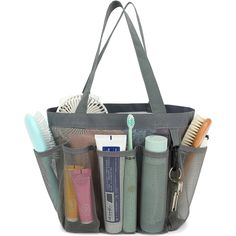 a large gray tote bag filled with personal care items and toothbrushes in it