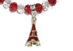 Adjustable Gold Plated Eiffel Tower Charm Bracelet for Girls . . Gold Plated Eiffel Tower Charm with Red Enamel. . Bracelet Size( adjustable) : 8-7/8" ( 6-1/2" + 2-1/4" adjustable Links) . Charm Size : Length : 7/8" and Width : 3/8" . Lobster Clasp Enclosure . Faceted Glass Beads in Red and Transparent Color . End Ring with Rhinestones . This beautiful bracelet is handmade with gold plated Eiffel tower charm in red and clear color faceted glass beads and has adjustable links for good fitting. . This bracelet is perfect for Girls gifts for Birthdays, Valentine's Day, Bridesmaid, Thanksgiving, Christmas and New Year. Chain Bracelet Diy, Charm Bracelets For Girls, Paris Bracelet, Jewelry Diy Bracelets, Teen Girl Gifts, Gemstone Cabochons, Gold Plated Bracelets, Girls Jewelry, Faceted Glass