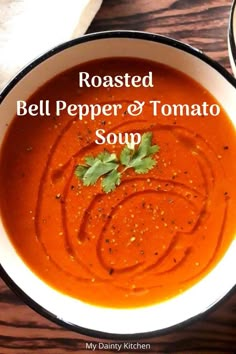 roasted bell pepper and tomato soup in a white bowl