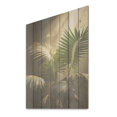 a wooden wall with palm leaves painted on it