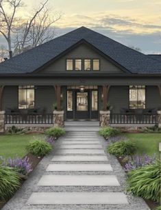 the front view of a house with steps leading up to it's entry door