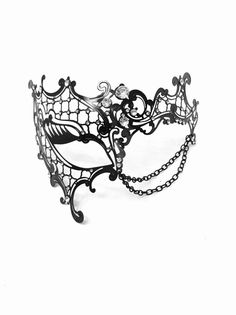 This mask is a work of art, featuring intricate laser-cut patterns that exude elegance and allure. Gracefully draped chains and rhinestones add a touch of glamour, ensuring you stand out at any masquerade event. Choose from classic black, elegant gold, or sleek silver to complement your outfit and personality.


Age Group/Gender - Adult/Women

Size/Type - One size fits all adults

Mask Color - Gold, silver, black

Mask Material - Laser cut metal

Special Features -  Chains and rhinestones Black Masquerade Mask Women, Masquerade Event, Kids Party Packs, Twt Layout, Masquerade Mask Women, Black Masquerade, Black Masquerade Mask, Opera Mask, Oc Creator