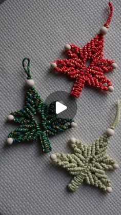 three beaded christmas ornaments on a table