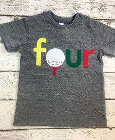 a t - shirt that says four with a golf ball on the front and green, red