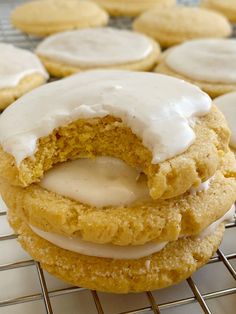 there are several cookies with icing on the cooling rack