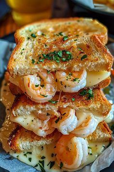 a grilled cheese sandwich with shrimp on top