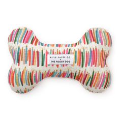 a bone shaped dog toy with colorful stripes on the front and bottom, it has a white