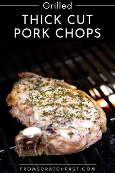 grilled thick cut pork chops on the grill with text overlay that reads grilled thick cut pork chops