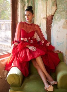 Editor's Note Playful yet chic, featuring a statement handmade floral corsages in a red cape set which includes a draped skirt, paired with a bralette & a flared cape. The cape is embellished with handmade 3D flowers and feathers. Fabric: Mono net, organza Color: Red Component: Cape, bralette and drape skirt Occasion: Cocktail Note: Product colour may slightly vary due to photographic lighting sources Care: Dry Clean Only About the Designer Varun Bahl, a renowned designer, skillfully blends the Evening Organza Dress With Cape Sleeves, Spring Party Evening Dress With Cape Sleeves, Fitted Cape Gown For Party, Festive Chic Dresses With Cape Sleeves, Red Organza Evening Dress, Red Organza Dress For Gala, Red Cape Dress For Party, Glamorous Fitted Cape Dress, Red Cape Evening Dress