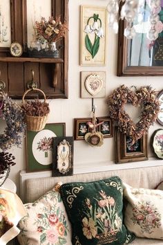 a living room filled with lots of furniture and pictures on the wall next to each other