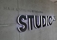 the studio sign is mounted on the wall