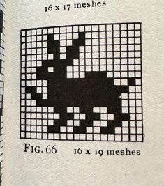 an old book with black and white squares on it's cover, showing the cross stitch pattern