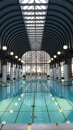 an indoor swimming pool is shown in this image