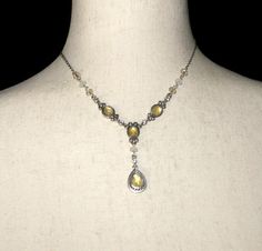 This item is a vintage Avon silver tone y-necklace with yellow, clear and white plastic and clear rhinestones. This necklace is 16 inches with a lobster claw clasp and Avon hallmark. DETAILS: ☼ Approximately 16 inches. ☼ Approximately 10.9 grams, total weight. ☼ ☼ ☼ ☼ ☼ ☼ ☼ ☼ ☼ ☼ ☼ ☼ ☼ ☼ ☼ ☼ ☼ ☼ ☼ ☼ ☼ PLEASE NOTE:  ☼ Different items on SALE everyday!  Check back often to take advantage of these bargains! ☼ FREE DOMESTIC SHIPPING on purchases of $35 or more. Combined shipping is still available t 90s Jewelry, Weird Jewelry, Yellow Gems, Avon Vintage, Wire Jewelry Designs, Y Necklace, Gem Necklace, Lobster Claws, Vintage Avon