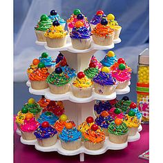 there are many cupcakes on the cake stand