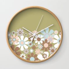 a clock with flowers painted on it