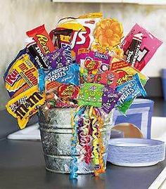 a bucket full of candy sitting on top of a table